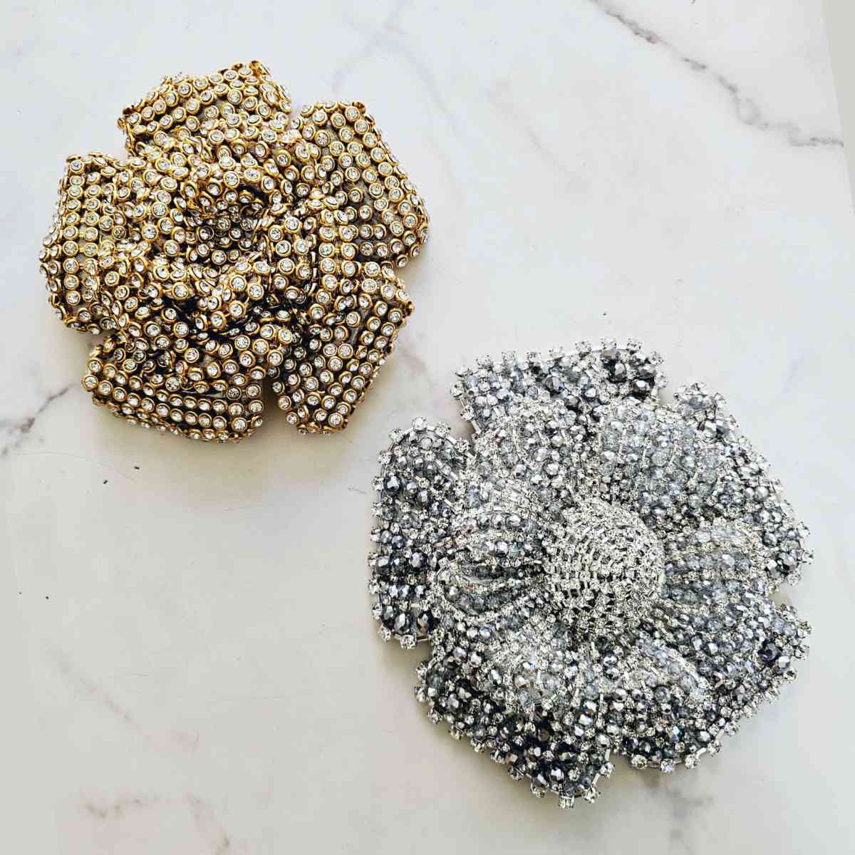 Flower and crystal brooches, various models